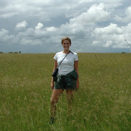 Ashley in grass field in Kenya