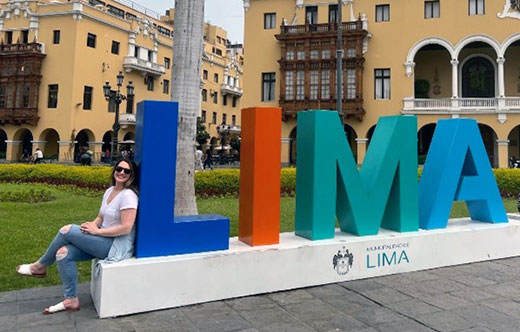 Chelsea next to Lima sign
