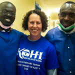 Dr. Kerre and with volunteers at a dental camp.
