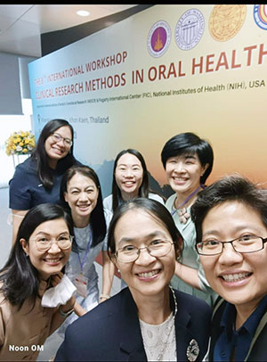 Dr. Oranart Matangkasombut (far right) and colleagues at research conference.