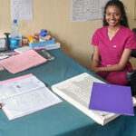 Divya Kannappan (middle) and Tania Munoz (right) with clinic staff member.