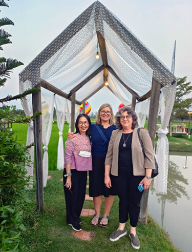 Christy McKinney (center) with Waranuch Pitiphat (left) and Susan Coldwell (right) at the 10th International Workshop on Clinical Research Methods in Oral Health in Khon Kaen, Thailand.