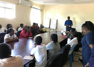 Dr. Arthur Kemoli, a member of the NIH R21 research team, presents project findings.