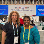 Dr. Seminario with speaker in conference hall.