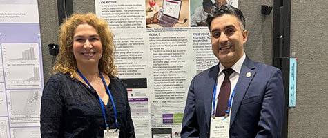 UW dental student Alireza Vahdati (right) and Dr. Ana Lucia Seminario (left) at Alireza’s poster presentation.