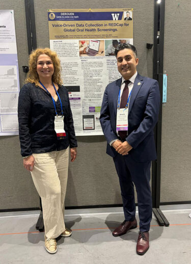 UW dental student Alireza Vahdati (right) and Dr. Ana Lucia Seminario (left) at Alireza’s poster presentation.